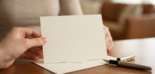 Handwritten wedding card with a heartfelt message and a pen