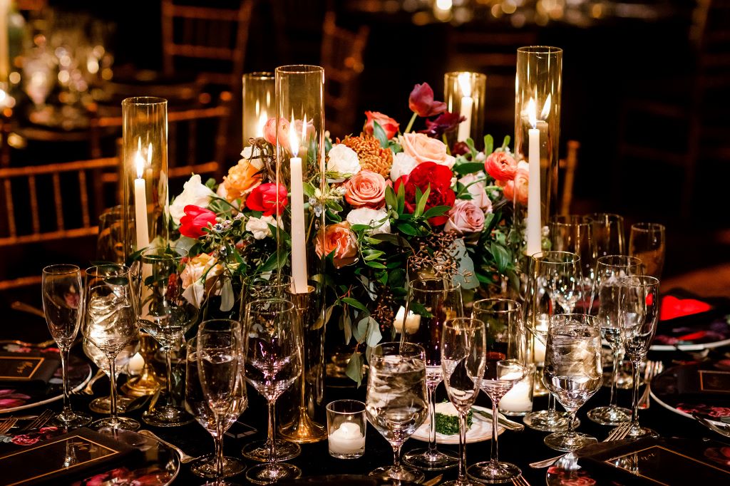 Wedding reception table decorated with elegant candles creating a romantic ambiance