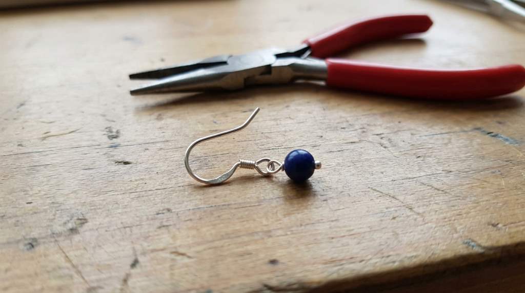 Sterling silver earring hook replacement with silicone stopper