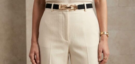 Woman wearing Jasgood gold buckle belt with high-waisted jeans